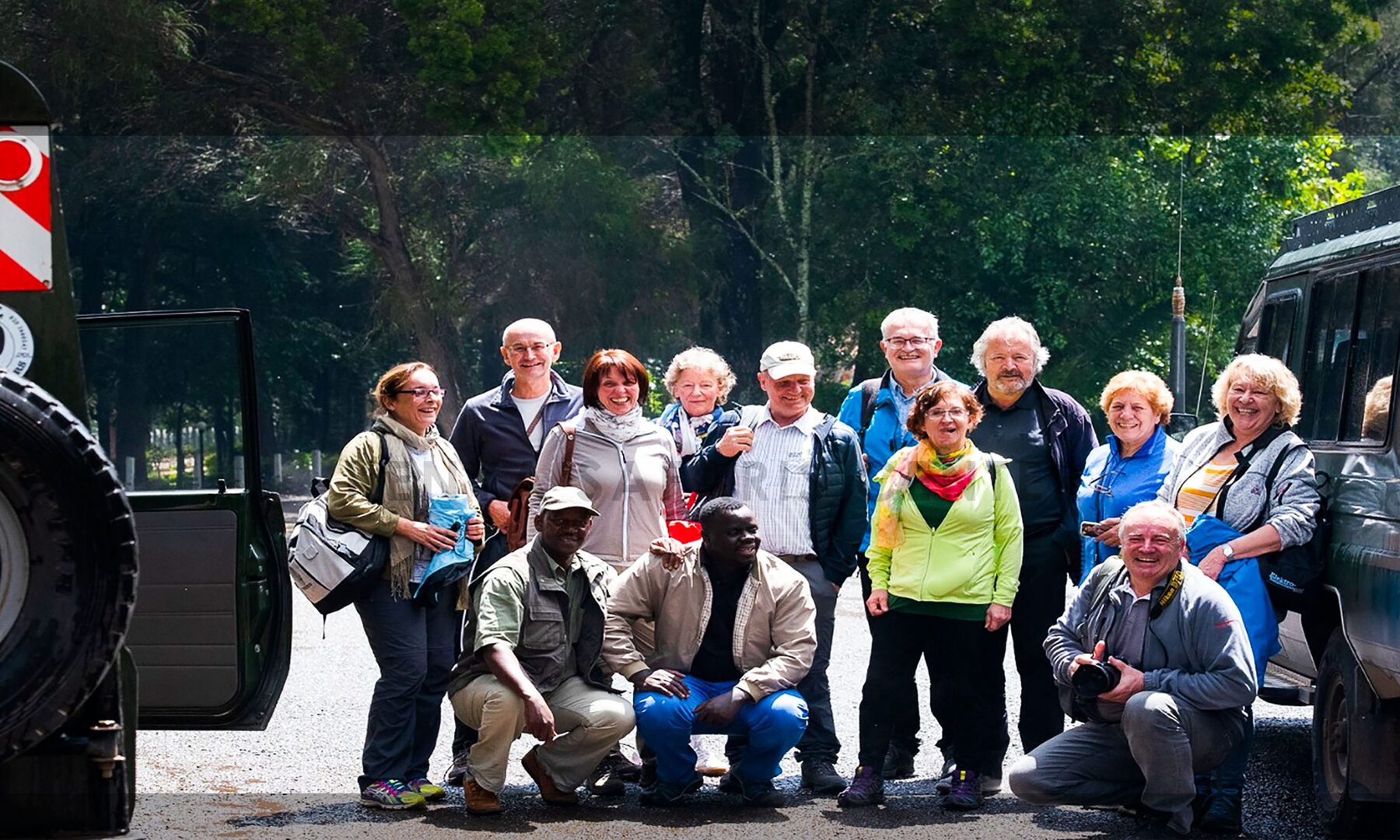 Travellers with their Kenya Safari Centre driver-guides and Land Cruisers before setting off on a road safari from Nairobi